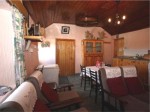 View of kitchen and living area at the traditional thatched cottage - available for holiday accommodation in Donegal, Ireland
