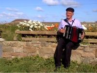 Patsy Dan playing the accordian on Tory Island